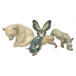 Four Lladro figures, comprising Leopard Butterfly no 11684, Bison Attacking no 5313, Rhino no 5437 and Bear Seated no 1206, all with original boxes, largest example H8cm