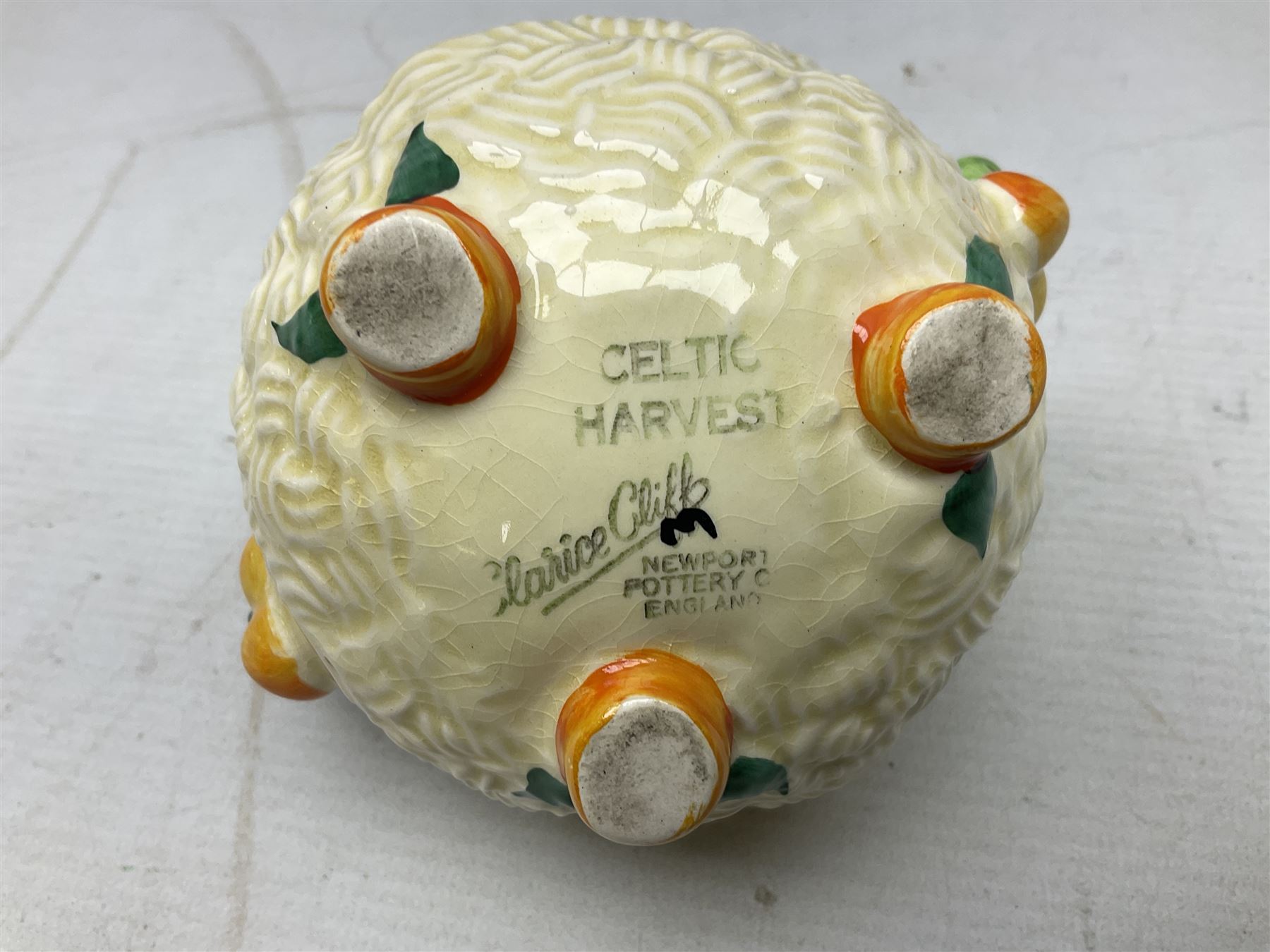 Clarice Cliff Celtic Harvest pattern sugar bowl, with original silver plate cover upon basket weave effect spherical body decorated with raised stylised fruit, H11cm