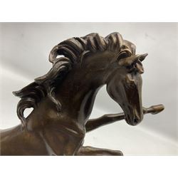 Bronze figure, modelled as a rearing horse, upon a rectangular black marble base, H27cm 