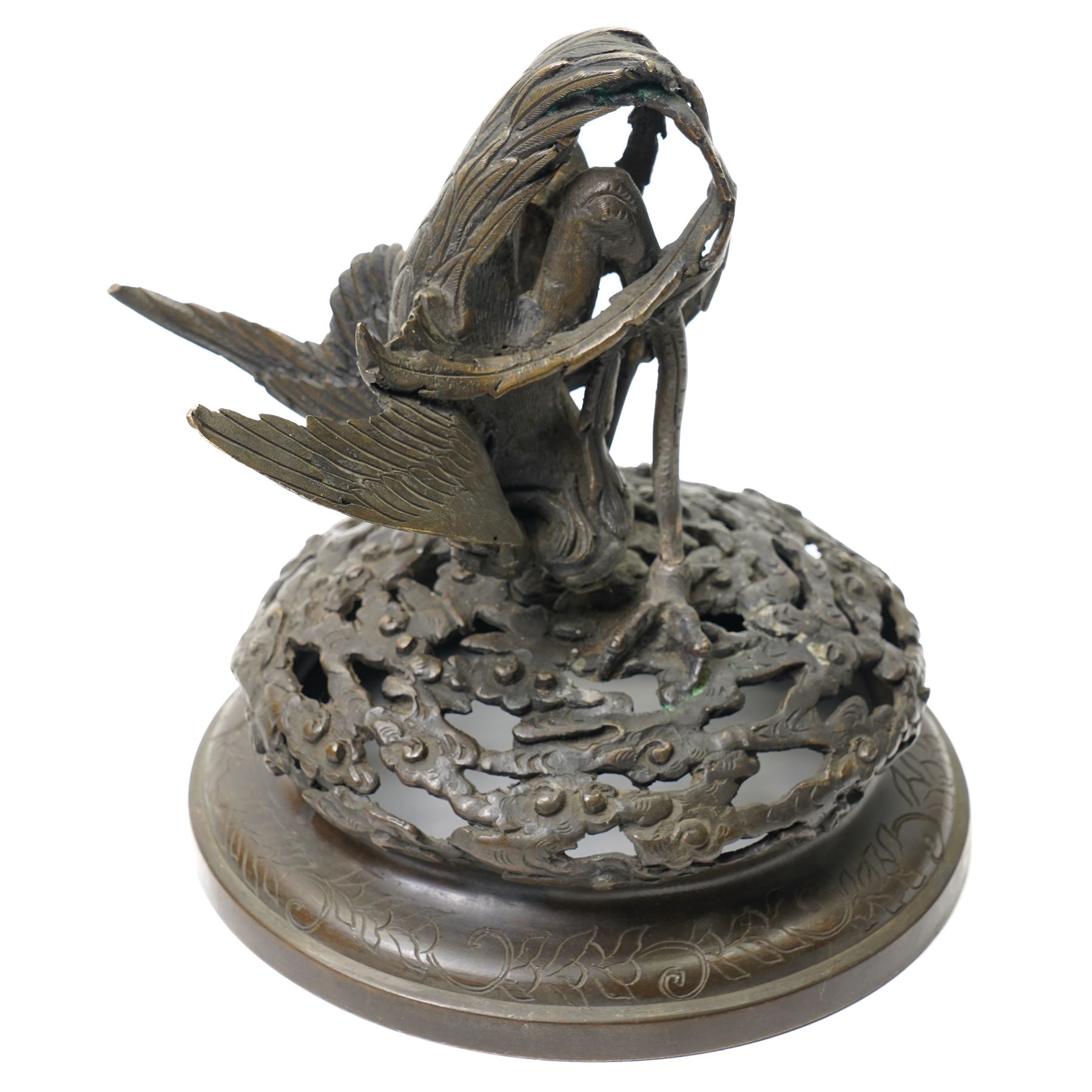 Japanese Meiji period bronze Koro, c.1870-1880, of squat baluster form, each foot with elaborate floral and mythical creature decoration, the body depicting two lions in chase, the rim with Greek key border, the pierced cover with eagle finial, Yoshida foundry mark to base, H50cm