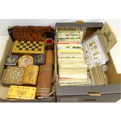  Collection of treen boxes, two Japanese Lacquer style boxes, folding chess set, two inlaid boxes and matched vase and a collection of Cigarette card albums & other ephemera in two boxes  