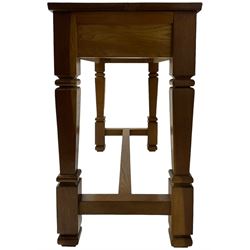 Solid oak console table, rectangular top raised on turned square supports united by stretcher