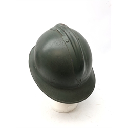  WW2 French Infantry green painted steel helmet, with DP and grenade crest, adjustable leather interior and chinstrap, L31cm  