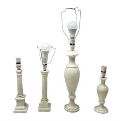 Four white hardstone table lamps with marble effect, two of classical urn form and two of column form,  tallest example H48cm