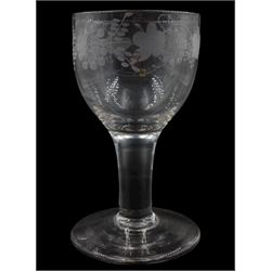 Mid/late 18th century glass goblet, the cup bowl engraved with fruiting vine border, upon a thick plain stem and thick plain foot, H15cm