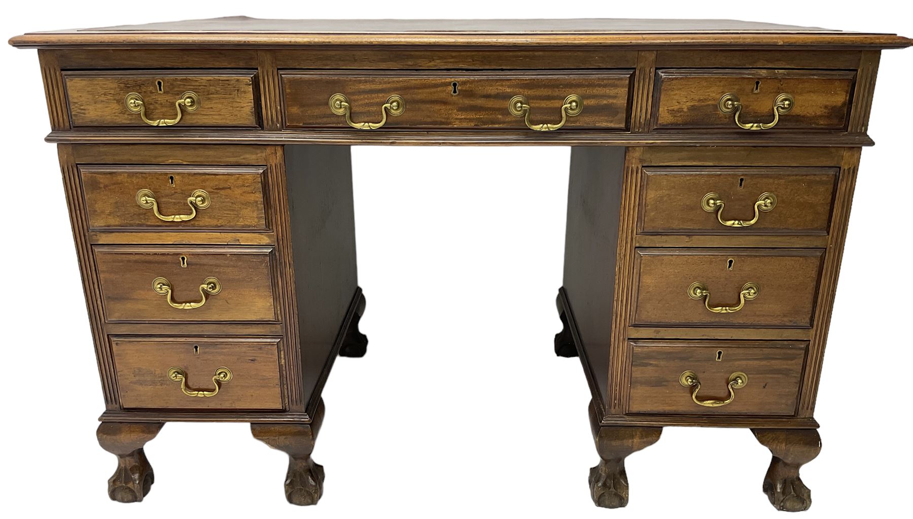 Early 20th century mahogany twin pedestal desk, fitted with nine drawers, on ball and claw carved cabriole feet