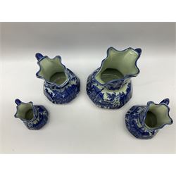 Set of four blue and white ironstone graduated jugs decorated with town scenes, figures and trees, all stamped beneath, tallest H23cm