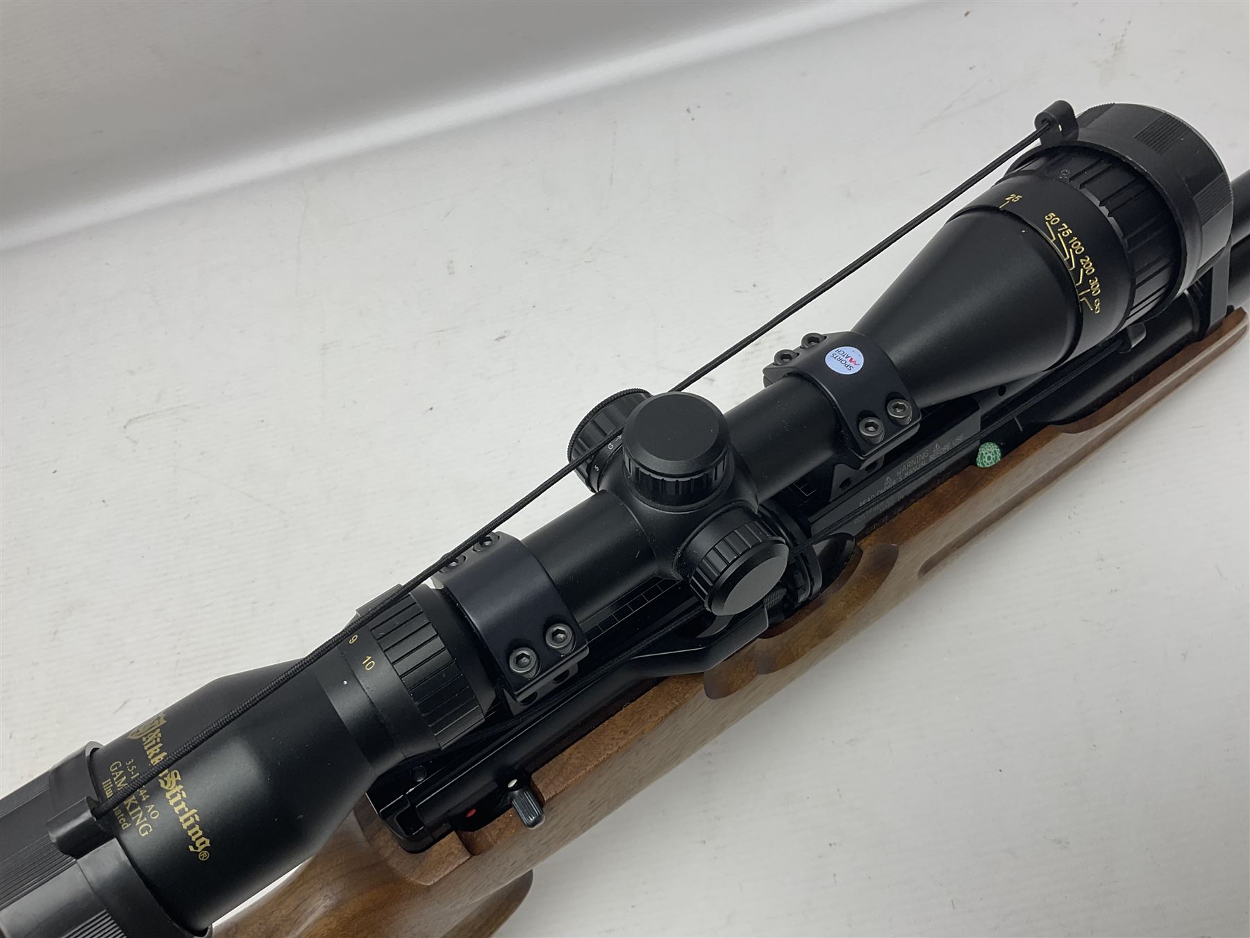 Weihrauch Sport HW100 .177 calibre PCP repeating air rifle; walnut thumbhole stock with textured pistol-grip; fourteen-shot magazine; Nikko Stirling Gameking 3.5 -10x44 illuminated telescopic sight; No.1922087 L90cm overall; in Napier fleece lined gun sling; with re-filling air tank and quantity of pellets NB: AGE RESTRICTIONS APPLY TO THE PURCHASE OF AIR WEAPONS.