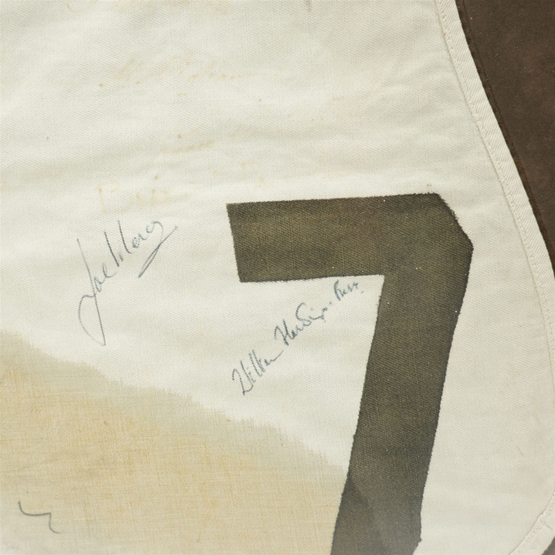 Signed saddle cloth, previously on display in the Mount Royale Hotel, York, autographed by various visiting jockeys and racing related television persons, to include Pat Eddery, Brough Scott, John McCririck, Peter O Sullivan, Willie Carson and others, frame 85cm x 69cm 