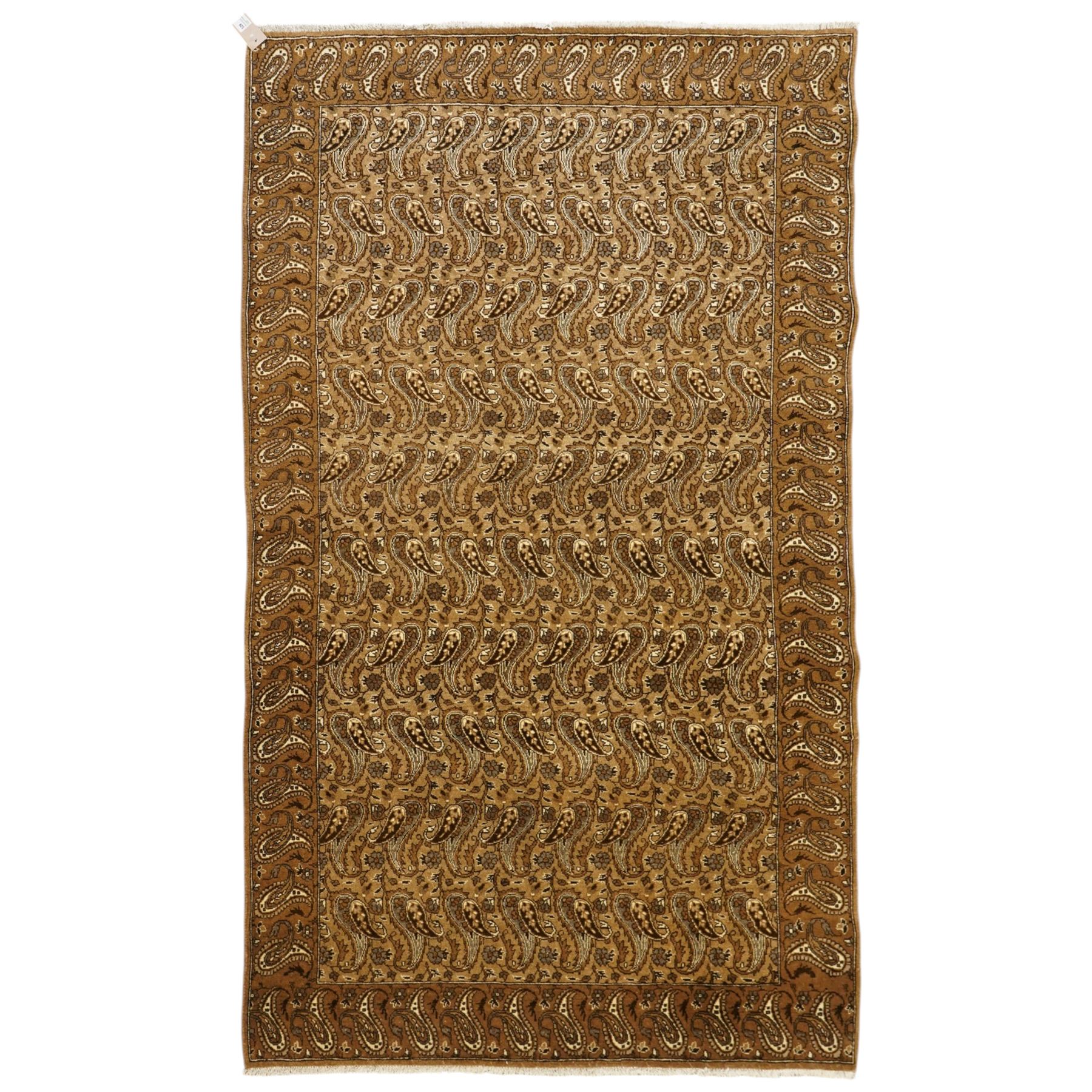 North West Persian Tabriz hand-knotted carpet, field with an all-over repeating boteh design arranged in rows, enclosed by a complimentary border flanked by guard stripes, in a palette of camel, beige and brown tones, with cotton fringe ends 