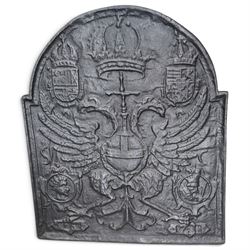 Early 20th century cast iron fireback, after an 18th century Flemish original, the arched plate cast in relief with the crowned Habsburg double-headed Imperial eagle and armorial shields of Charles V, Holy Roman Emperor
