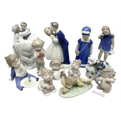 Royal Copenhagen figure group of couple kissing, together with to B & G figures and nine Nao figures 