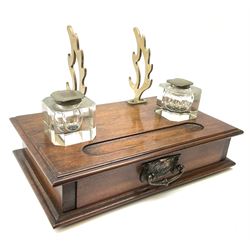 A late Victorian mahogany desk stand, with pen stand, twin glass inkwells and pen tray, above a single drawer, overall H20cm L30.5cm D18.5cm.
