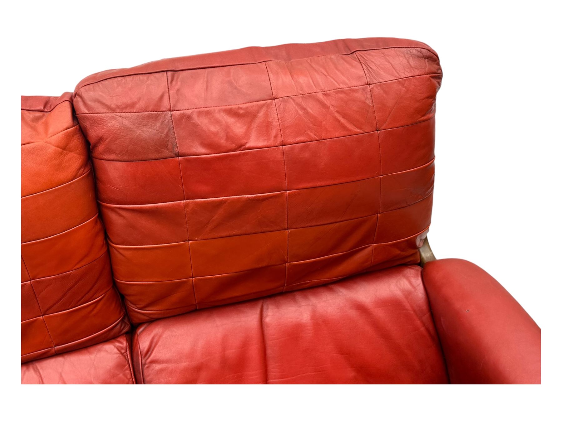 Folke Ohlsson for Gimson & Slater - mid-20th century Danish teak-framed sofa, red leather upholstery with patchwork design, raised on shaped teak side supports