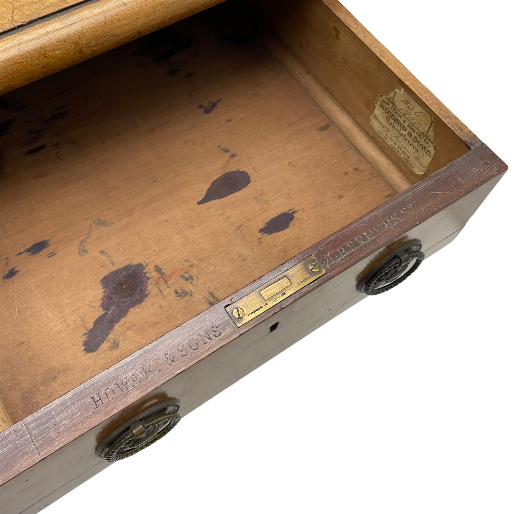 Howard & Sons. - 19th century walnut twin pedestal desk, moulded rectangular top with tooled leather inset, fitted with nine drawers with circular pressed brass handle plates decorated with urns, each drawer fitted with a 'Hobbs, London' lock, on plinth base, the upper right-hand drawer stamped 'Howard & Sons, Berners St.' and with paper label