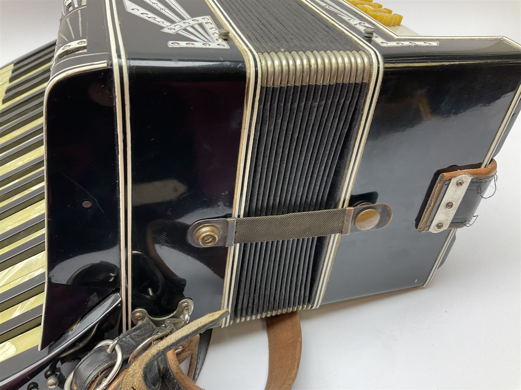 Italian Mantovani piano accordion with Art Deco style black and white case, twenty-four keys and one-hundred and twenty buttons L52cm in carrying case