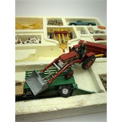 Corgi Toys Agricultural Gift Set No.5 containing Massey-Ferguson 165 Tractor with shovel and skip and churns attachment with two churns, Tandem disc harrow, farm tipper trailer with raves, Land Rover, Dodge Kew Fargo truck with four cattle and four pigs, farm worker and dog,  eleven large sacks and five small sacks, boxed