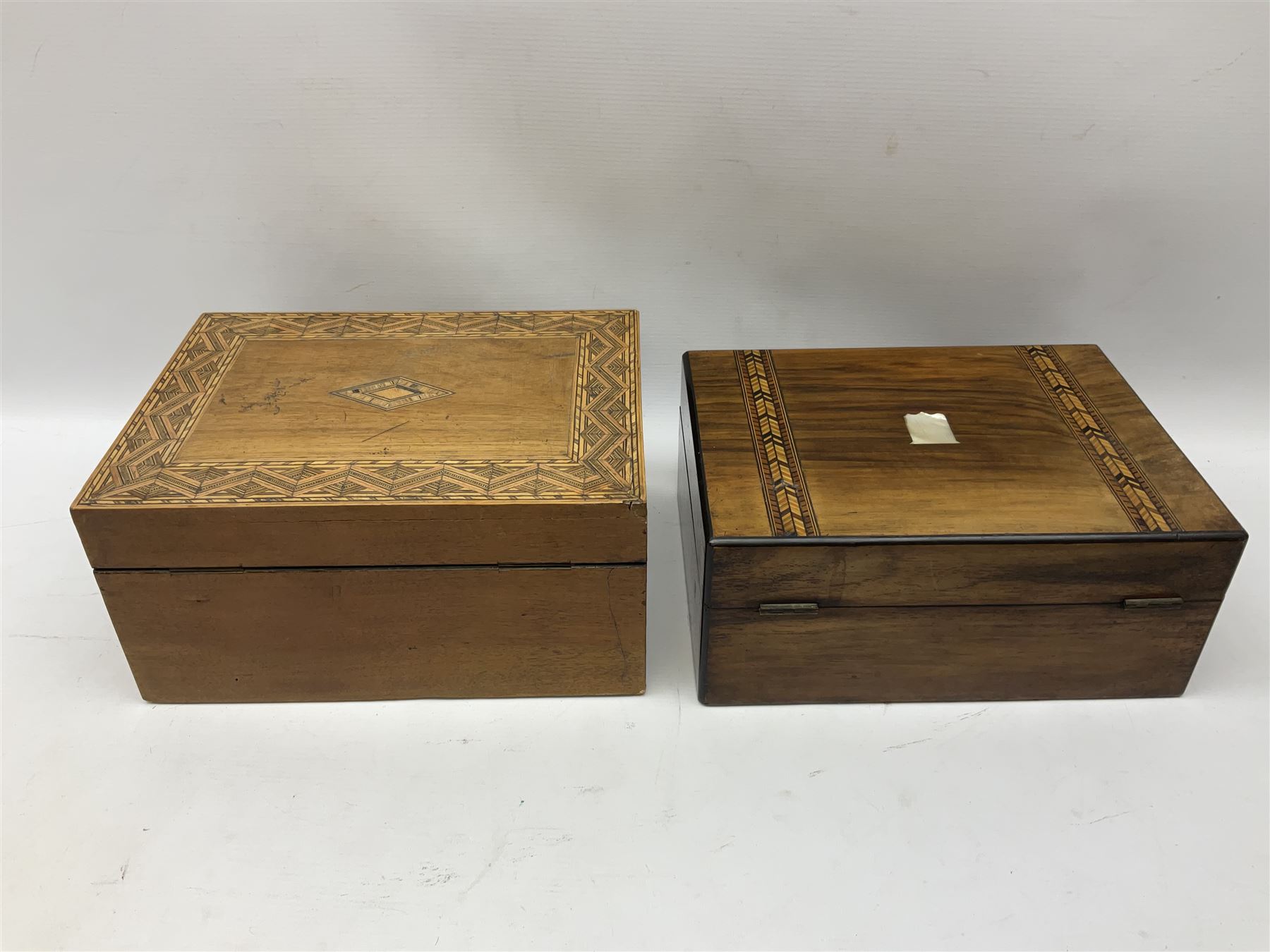 Oak sewing box with geometric inlaid decoration, the hinged lid lifting to reveal compartmented interior with lift out tray together with another mahogany example with mother of pearl and marquetry inlay decoration, both for restoration, largest H15cm W30cm D22cm