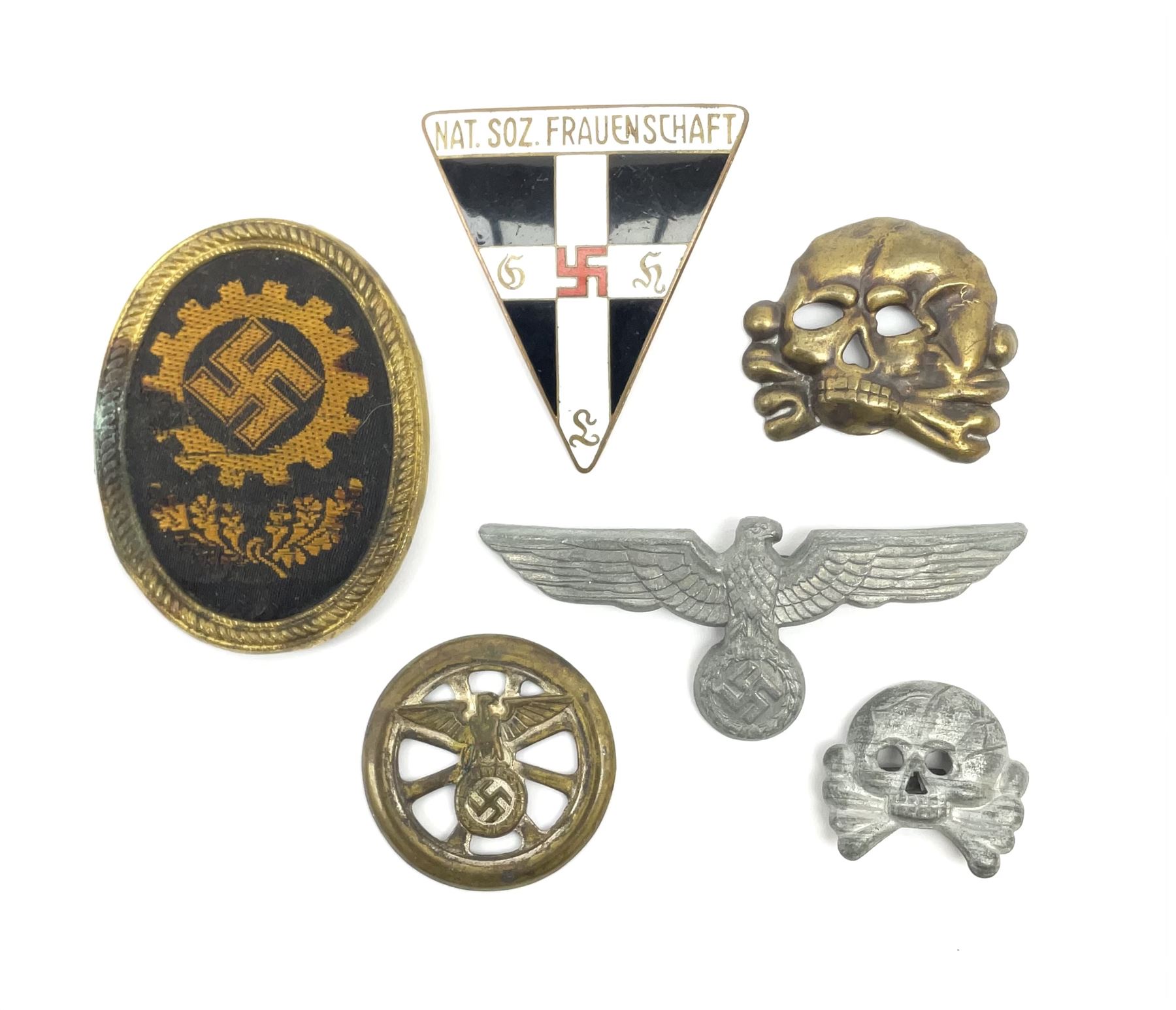 Six WW2 German badges - cap badge D.A.F. labour front; SS skull cap insignia  First pattern 1925-35; Frauenschen Mother's Union; tank driver collar badge  1939-42; N.S.K.K. cycle corps; and officer's ca -