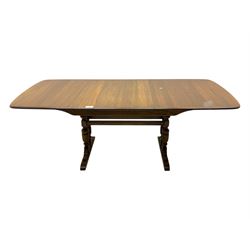 Ercol - late 20th century oak refectory dining table, rectangular top with rounded corners and central extending leaf, raised on turned baluster supports united by a stretcher (Extended 200cm)