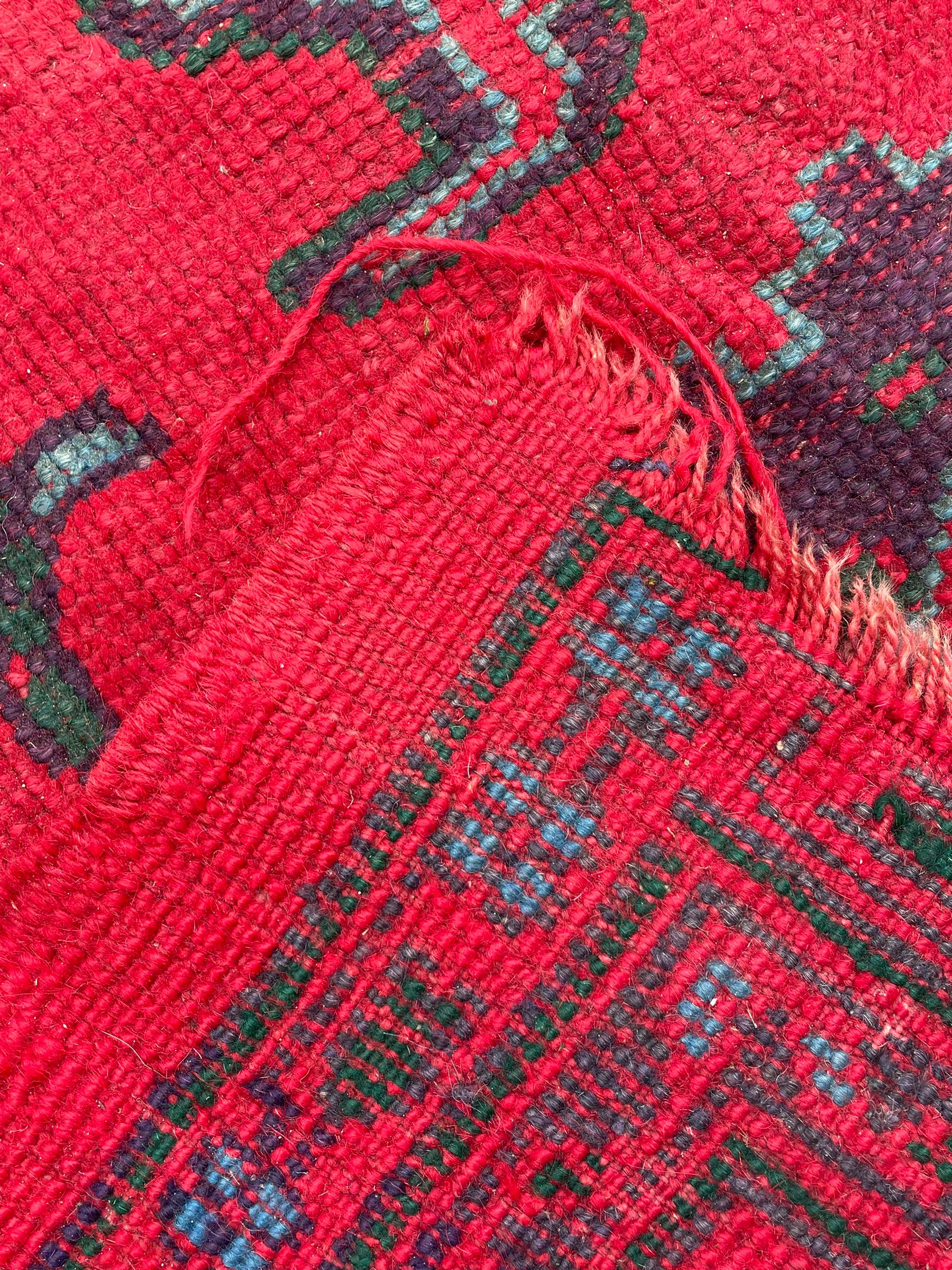 Early 20th century Western Anatolia Turkish Oushak crimson ground carpet, decorated with large Palmettes with trailing branches, the main border decorated with repeating stylised motifs within guard stripes 