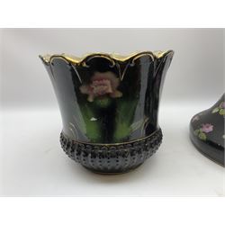 Jardiniere with gilt and floral decoration on a black ground, together with a similar plant stand with rose decoration. 