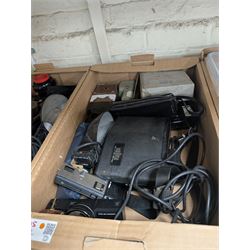 Collection of camera flashes and light meters, including Weston Master light meters, Braun Hobby flash, Hanimex XP1, in two boxes