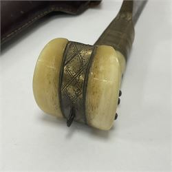 Afghan Khyber knife (Choora), blade engraved along the top edge with ornate brass and bone grip, with leather scabbard, overall L31cm, blade L20cm