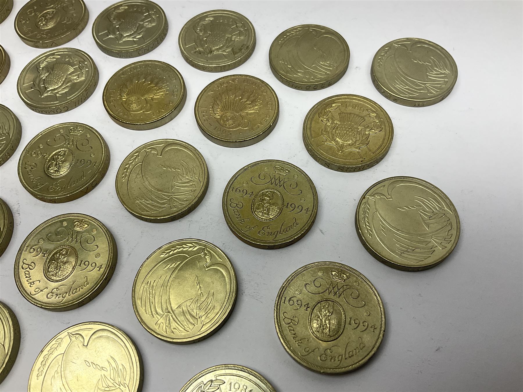 Twenty-eight Queen Elizabeth II old style two pound coins, including 1994 'Bank of England' etc