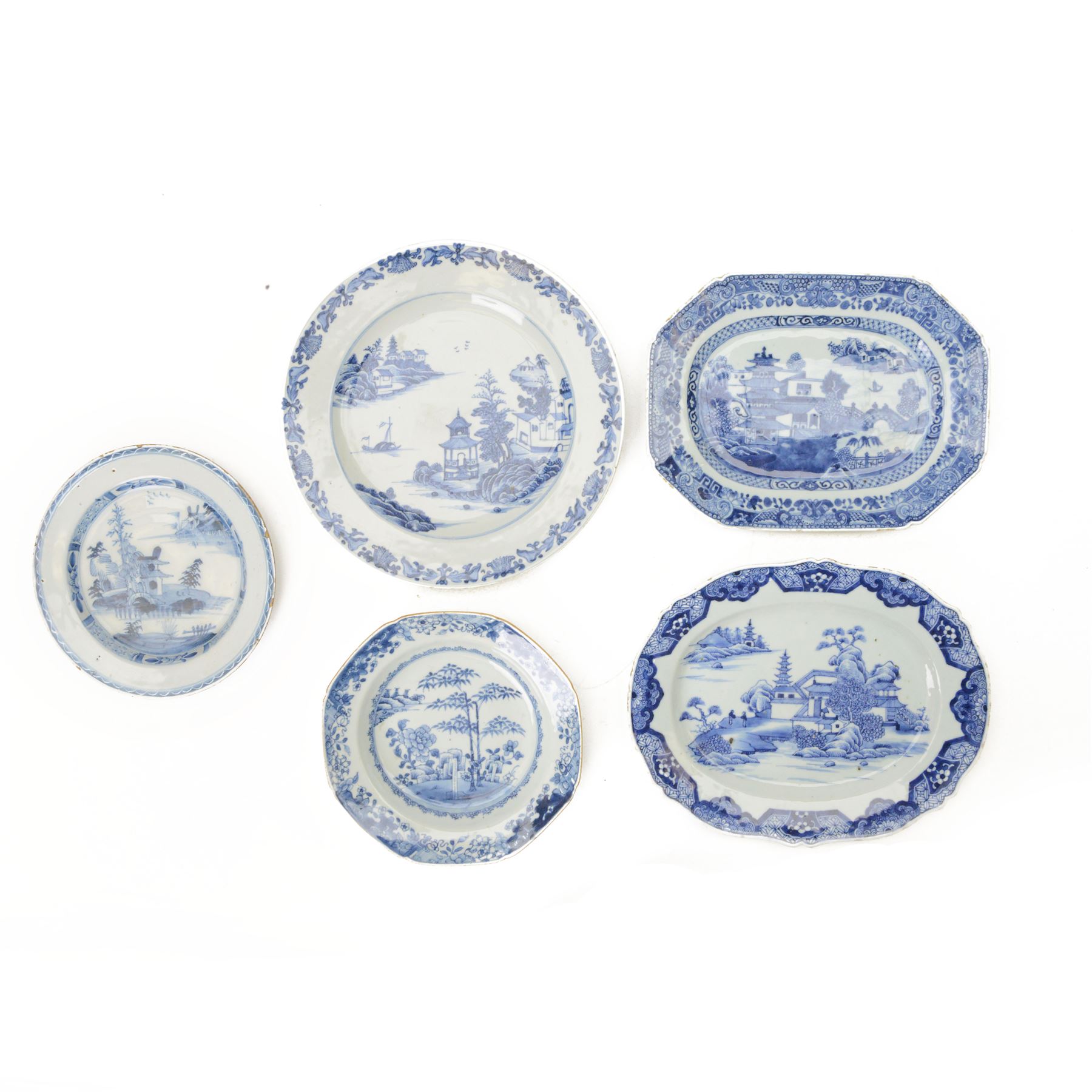 19th century Cantonese plate of octagonal form decorated to the centre with a garden of flowering peonies, together with two other 19th century plates and two serving platters each depicting temples in landscapes, octagonal plate W31cm  