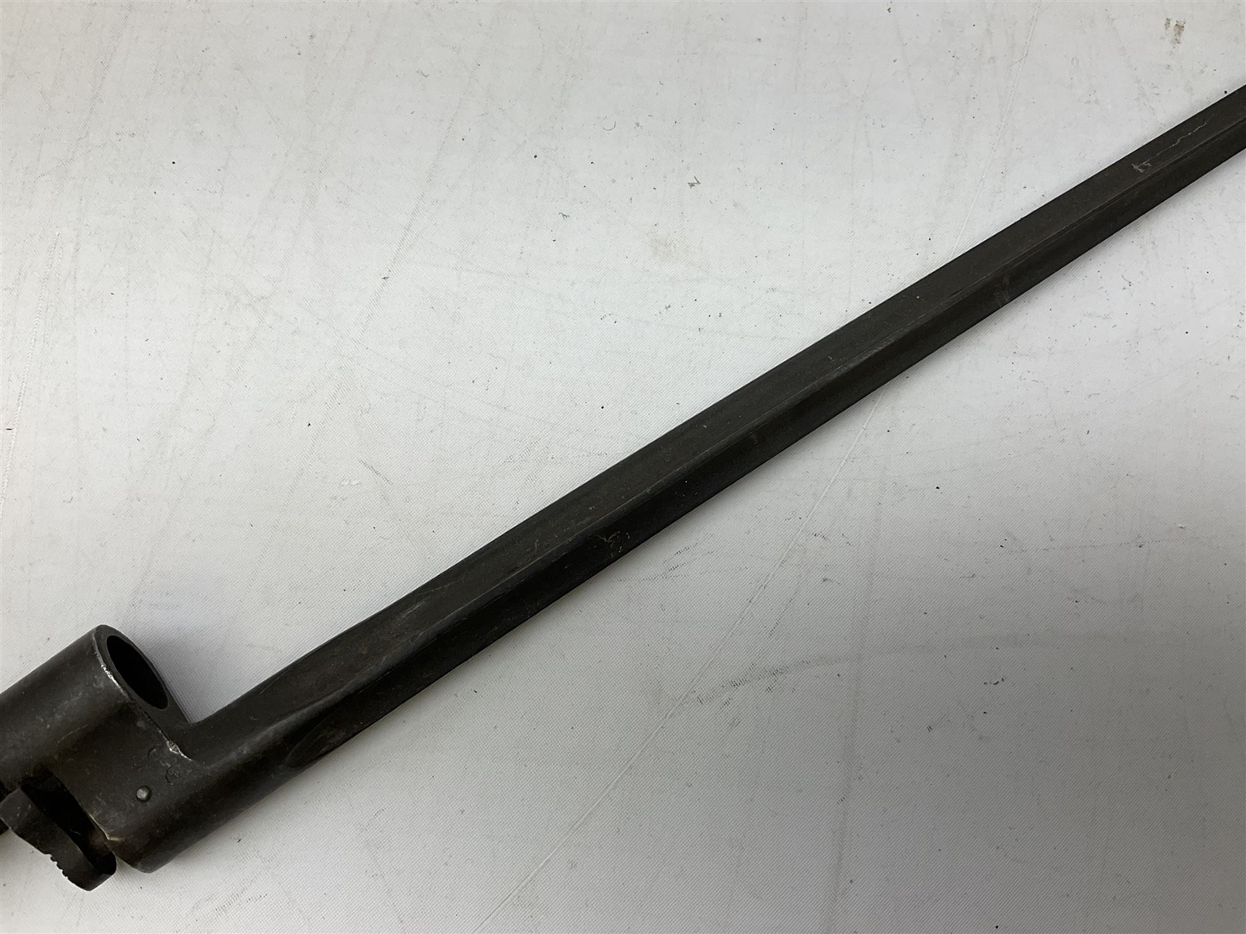 British Pattern 1876 socket bayonet with 43cm steel triangular blade L52cm overall; another socket bayonet with cruciform blade; No.4 Mk.II spike bayonet in metal scabbard with webbing frog; and 1955 Army jack knife by J.H. Thompson Sheffield (4)