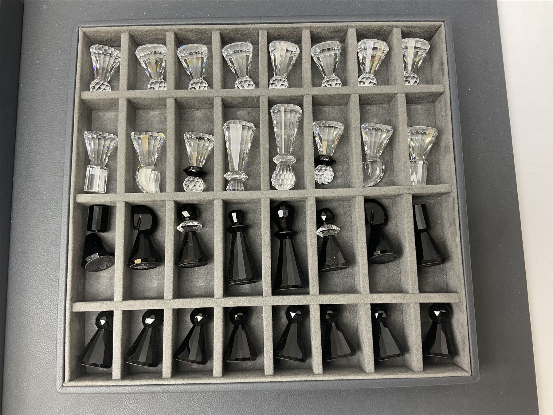 Swarovski silver crystal cut glass chess set, with clear and black pieces on mirrored board, in original presentation box 