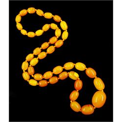 Single strand graduating oval butterscotch amber bead necklace, with three additional loose amber beads