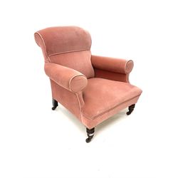 Victorian upholstered armchair, turned supports and castors 