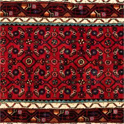 North West Persian Malayer runner, madder red field decorated with an all-over design of stylized herati motifs in shades of indigo, ivory, and green within ivory and dark blue borders of angular vine and rosette design, with cotton fringe ends 