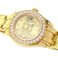 Rolex Oyster Perpetual Datejust Pearlmaster ladies 18ct gold automatic wristwatch, Ref. 69298, Serial No. T293223, champagne dial with diamond hour markers and diamond set bezel, on original 18ct Pearlmaster bracelet with fold-over clasp, with papers