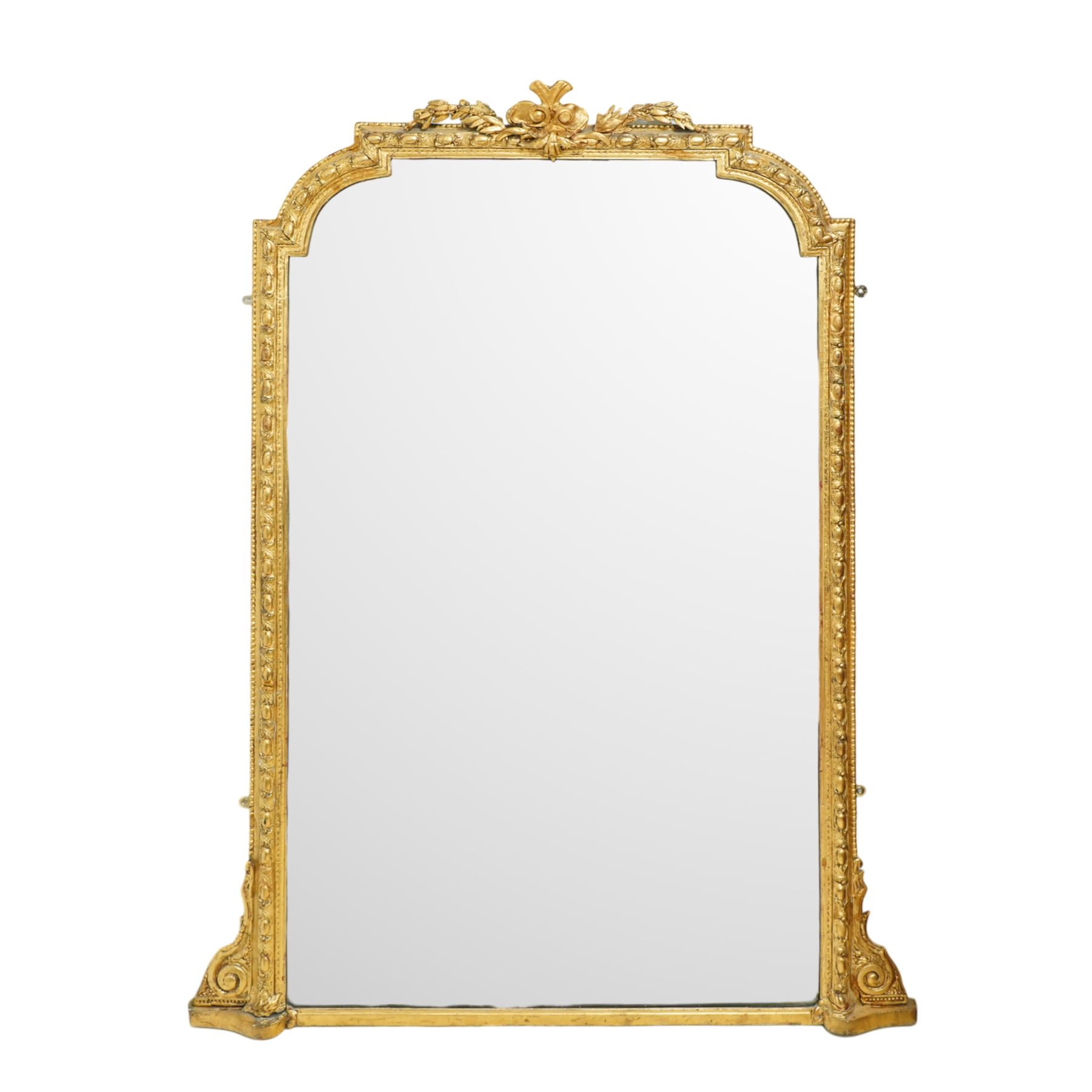 Victorian giltwood rococo revival overmantel mirror, arched top with plume crest of scrolling acanthus leaves flanked by symmetrical foliate scrolls 