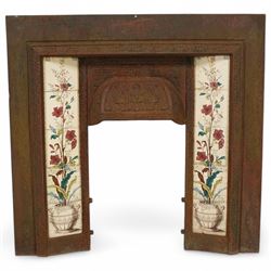 Late 19th century cast iron fire inset, with tiles decorated with flowers 