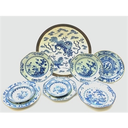  A Chinese blue and white crackle glaze charger, decorated with three temple dogs amidst auspicious clouds, with impressed character mark to base, D37.5cm, together with seven assorted Chinese blue and white plates, all unmarked.   