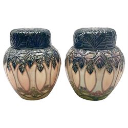 Two Moorcroft ginger jars, decorated in the Cluny pattern designed by Sally Tuffin, with impressed and painted marks beneath, including date symbols for 1995 and 1999, H11cm. 