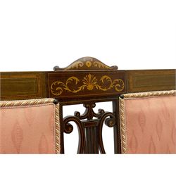 Edwardian inlaid mahogany two-seat settee or hall bench, the cresting rail inlaid with satinwood banding and boxwood stringing, central panel inlaid with scrolled leafy branches over pierced and carved lyre back, upholstered in peach fabric with repeating pattern, scrolled down sweeping arms, on square tapering supports with spade feet 