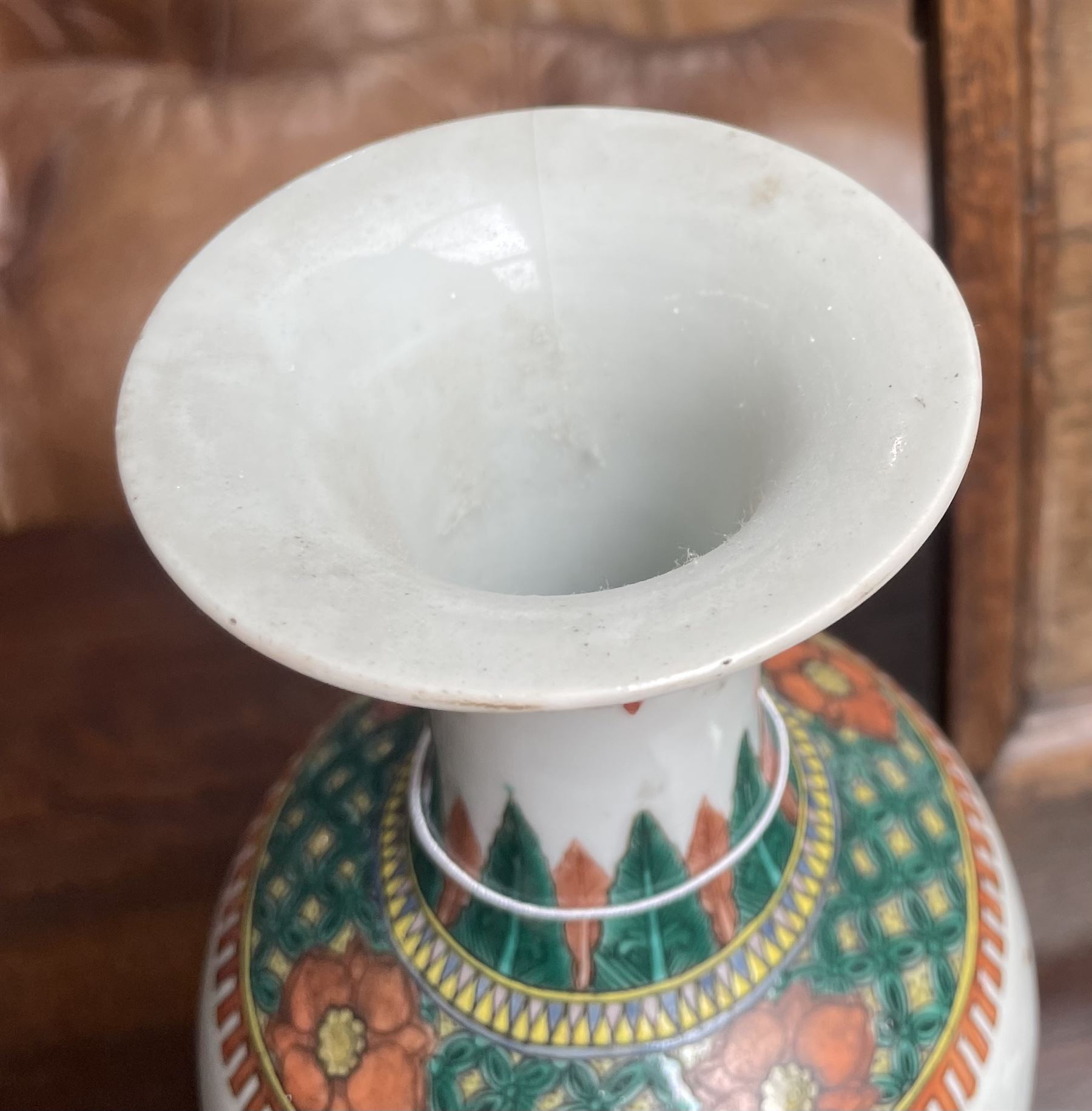 Chinese Kangxi famille verte vase of baluster form with fluted rim, decorated with sage and attendants within a trellis border, with four character Kangxi double ring mark beneath, H31cm 