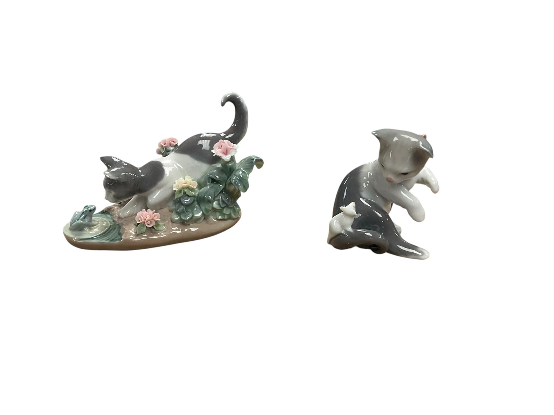 Two Lladro cat figures, comprising Cat and Mouse no 5236 and Kitty Confrontation no 1442, together with Royal Copenhagen cat and three other figures 