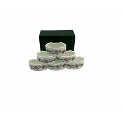 Minton Haddon Hall pattern tea and dinner wares, including basket dish, two covered tureens, six dinner plates, eight dessert plates, twelve tea plates, six soup bowls, six cereal bowls, teapot, coffee pot, milk jug, covered sucrier twelve tea cups and saucers, six mugs, footed bon bon dish, pair of candlestick holders, cake knife and slice etc (81)