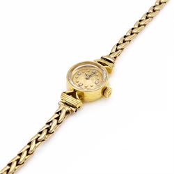 Omega ladies 18ct gold manual wind wristwatch, Cal. 483, gilt dial with diamond and dot hour markers, Helvetia hallmark, on 9ct gold bracelet, with fold-over clasp, Birmingham 1959