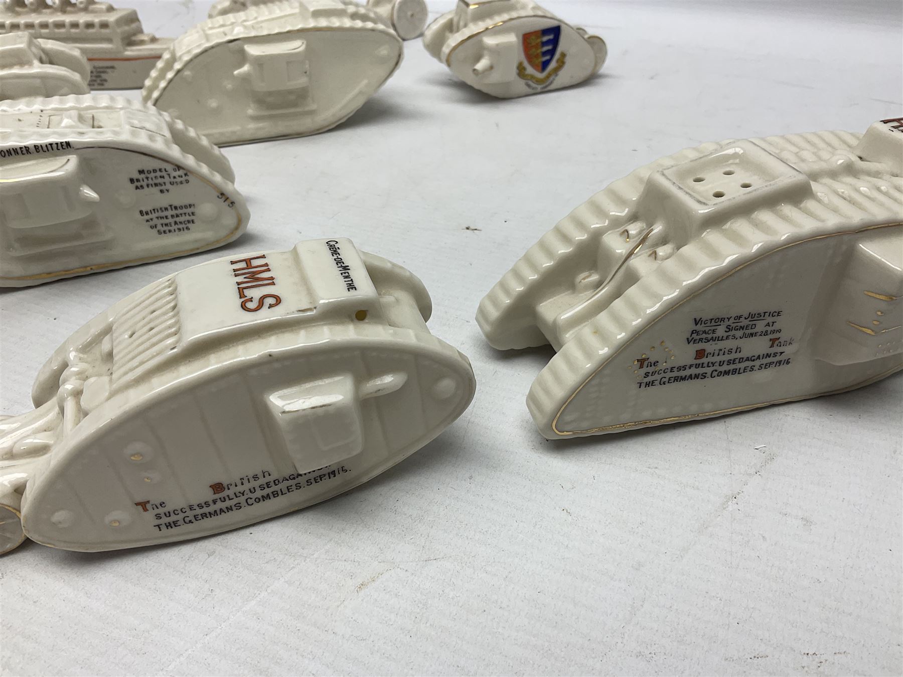 Twelve crested china models of WW1 tanks by Grafton, Arcadian and Carlton china etc with crests from Caistor Lincs, Saffron Walden, Paignton, Evesham etc  , together with a crested china model of the R.M.S Lusitania with New Brighton crest and a two-handled vase for 'The Forts Boxhill' (14)