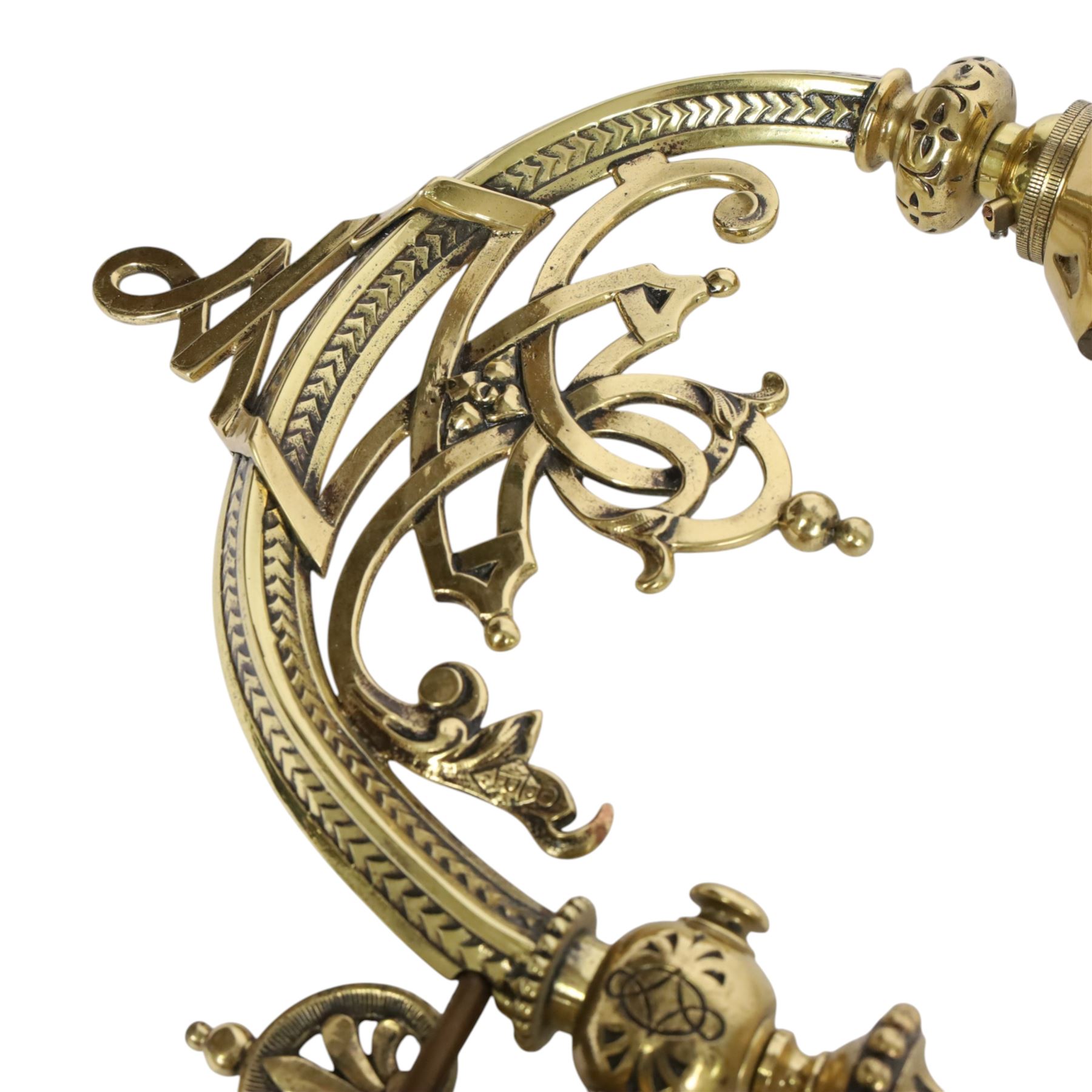 Pair of 19th century brass wall sconces, the articulated curved arms leading to single socket fitting detailed with entwined strapwork, Victorian diamond mark H24cm D28cm