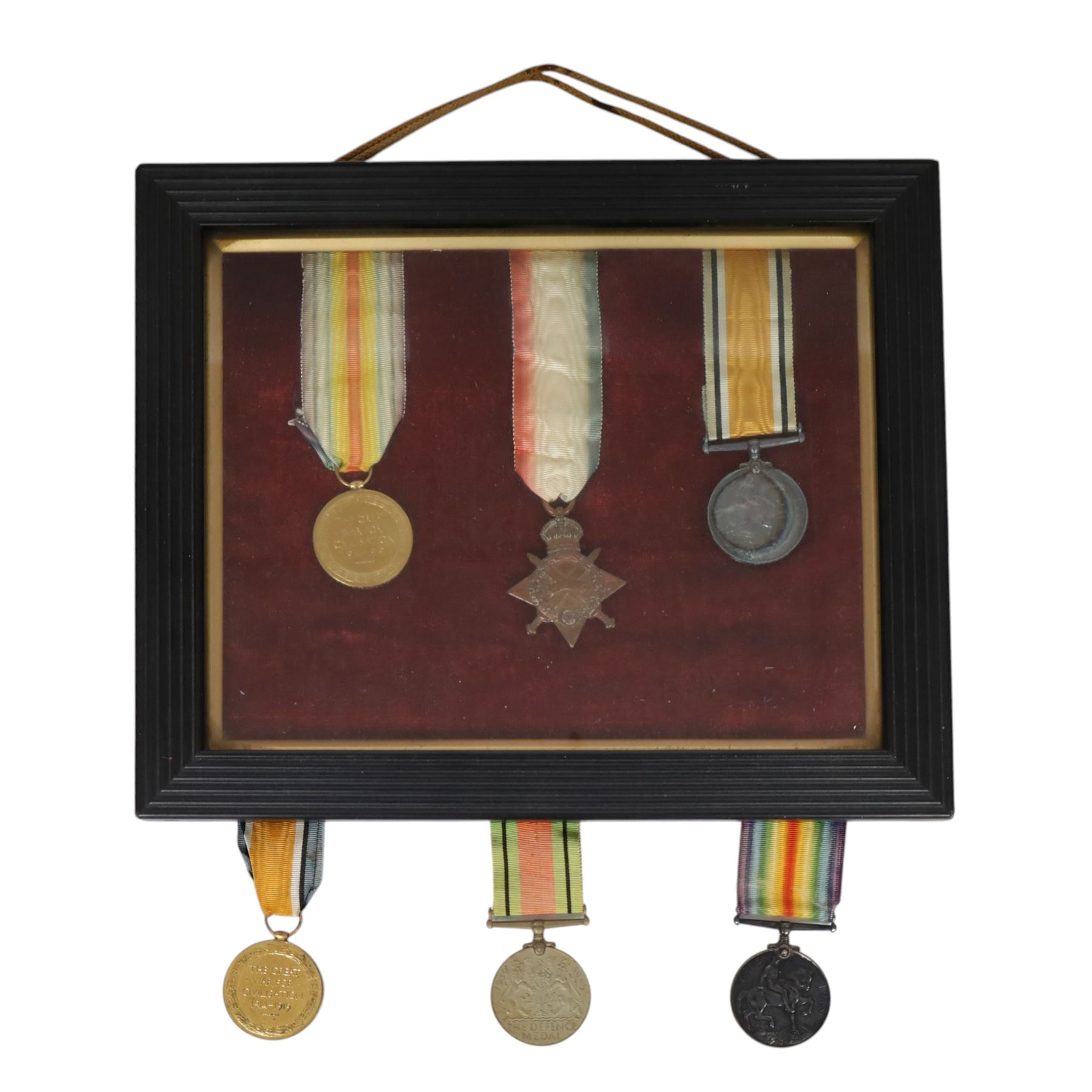 WWI medal trio; Victory medal, 1914/15 star and War medal, framed, together with WWI medal pair; victory and defence medals, awarded to 5832 Pte J Wilson North'O Fus, and WWII Defence Medal, framed