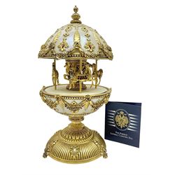 Franklin Mint House of Faberge; The Faberge Imperial Carousel Egg, with a carousel that revolves to the sound of the musical box operated by the winding key finial, H27cm