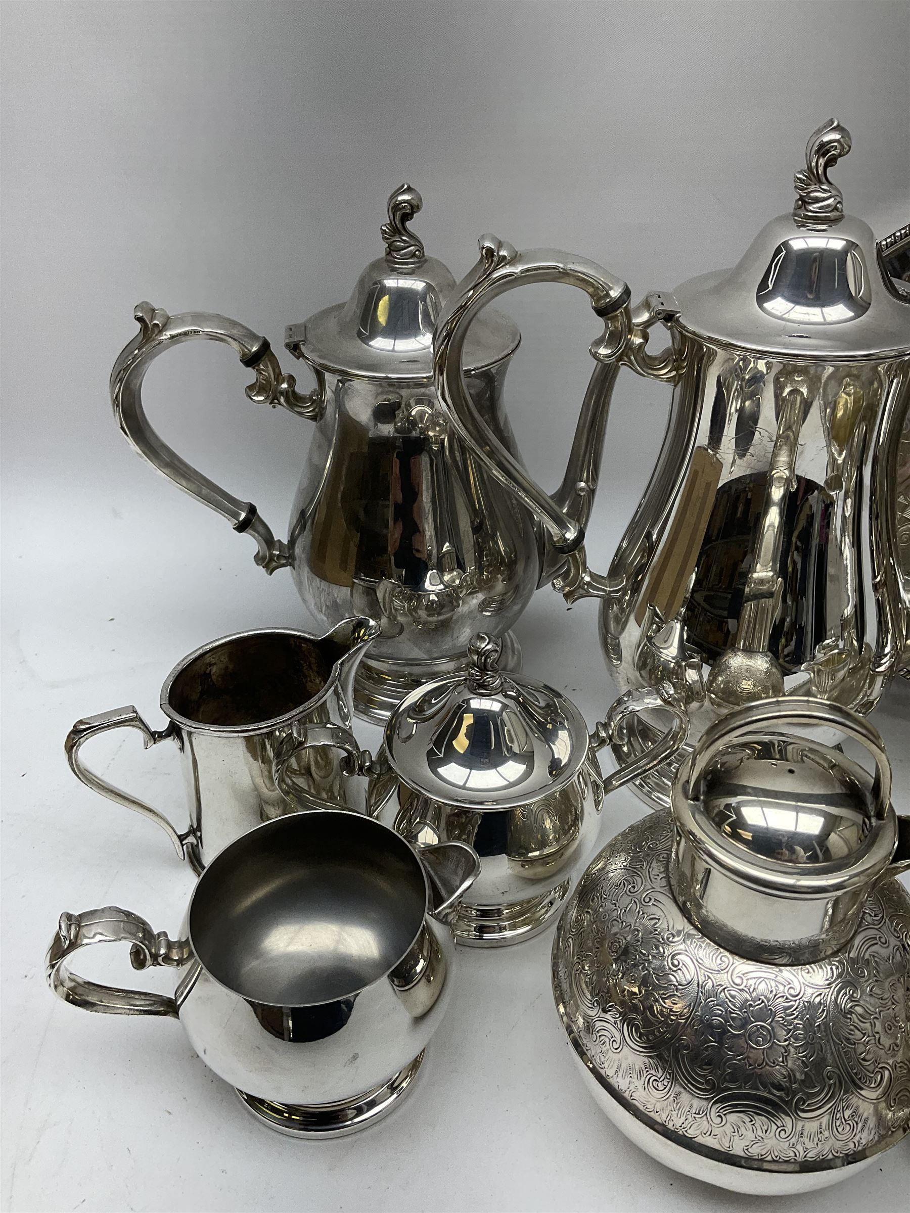 Silver plated tea set by H Fisher & Co of Sheffield comprising tea pot, open sucrier and milk jug, Viners of Sheffield 'Chased' tray, Onedian USA silver plated tea and coffee pots with lidded sucrier and jug, and other plated and similar items